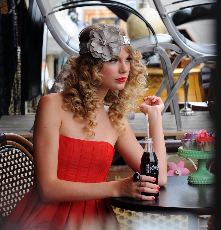 woman in red dress with soda