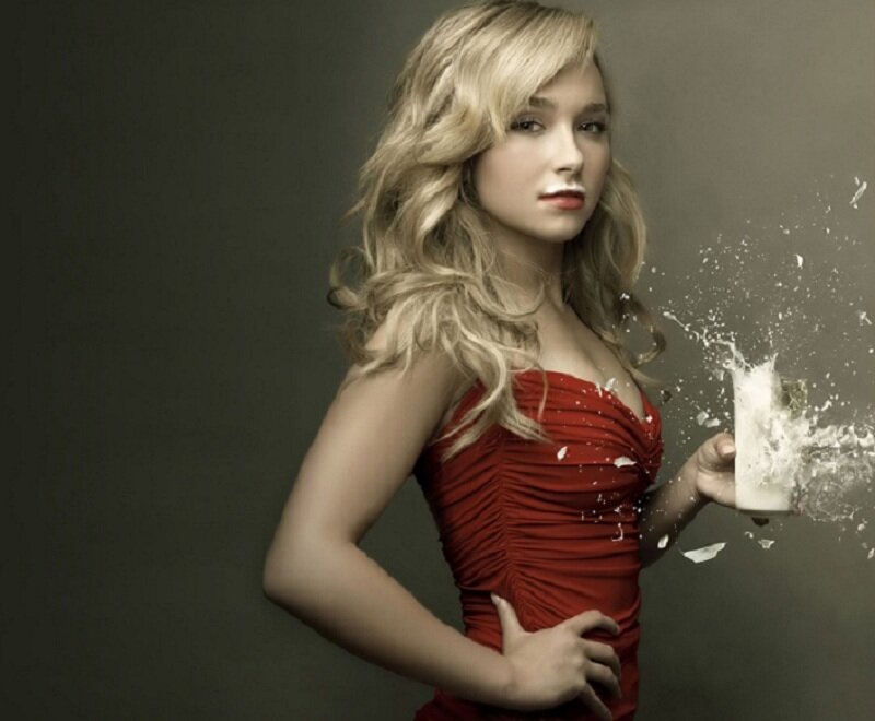 woman in red dress with splashing drink