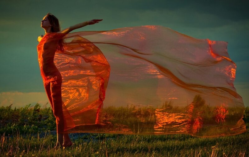 Woman in Red Fabric — Dramatic, Sunset