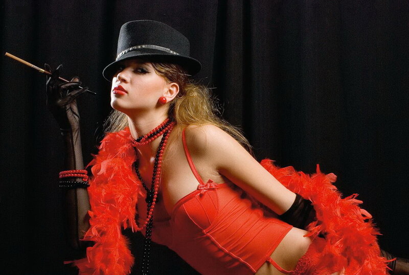woman in red feather boa