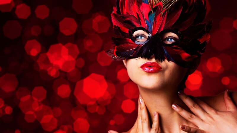 woman in red feather mask