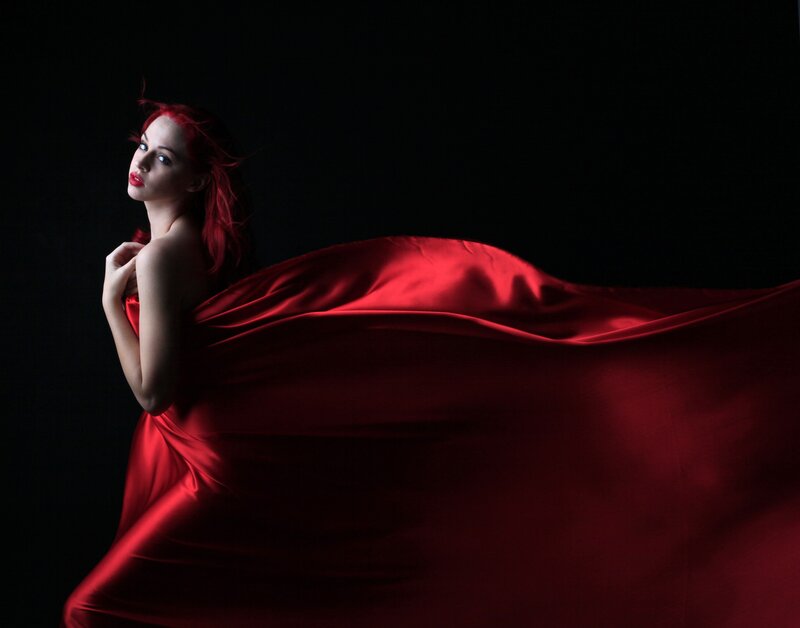 woman in red flowing fabric