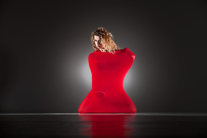 woman in red form-fitting suit