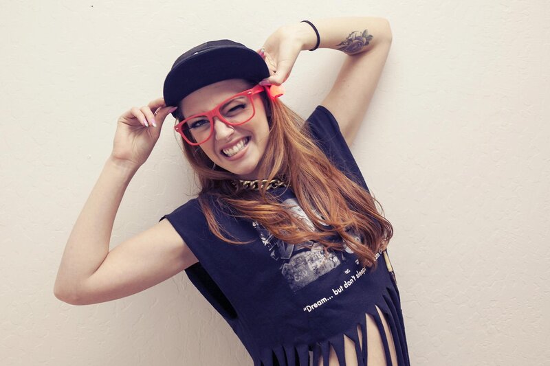 woman in red glasses smiling