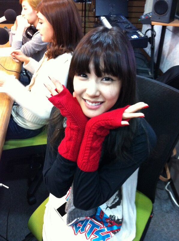 woman in red gloves smiling