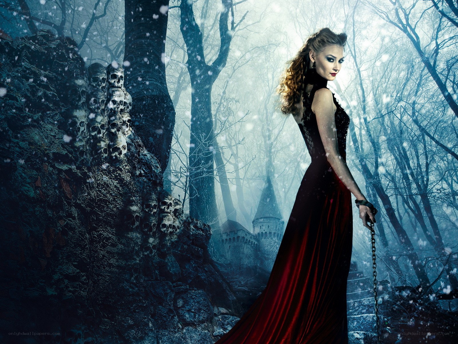 Woman in red gown in snowy forest