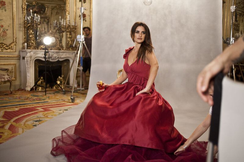 Woman in red gown on photo set
