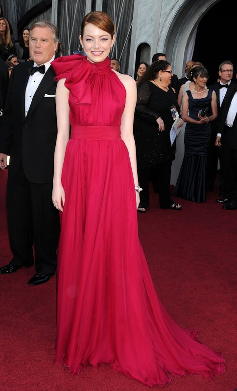 woman in red gown on red carpet