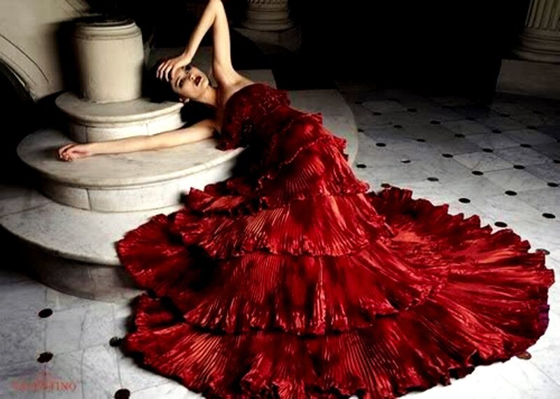 Woman in red gown on steps