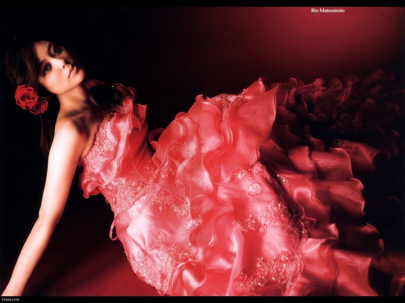 Woman in red gown with roses