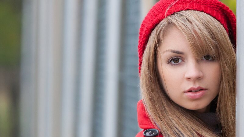 woman in red hat and coat