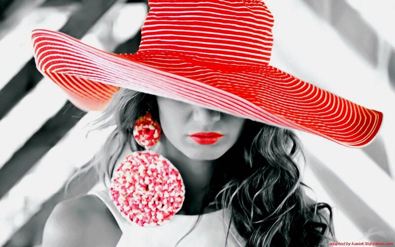 woman in red hat and earrings