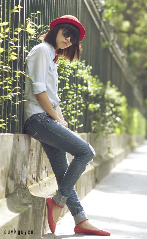 woman in red hat and jeans