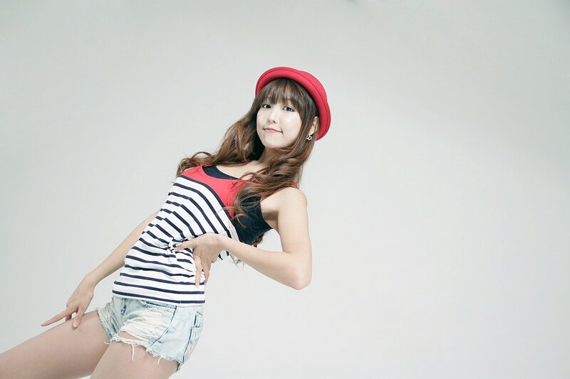woman in red hat and striped top