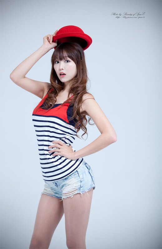 woman in red hat and striped top