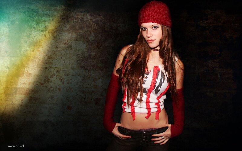 woman in red hat and striped top