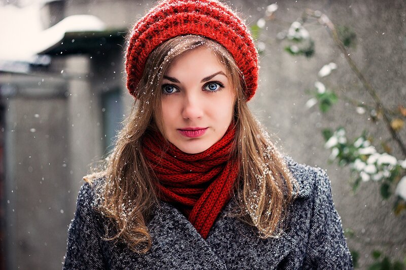 woman in red hat during snow