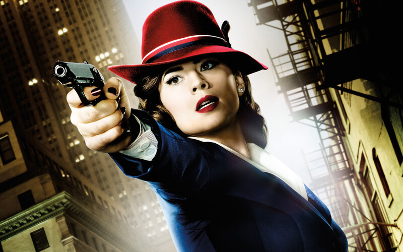 Woman in Red Hat Holding Gun — Dramatic