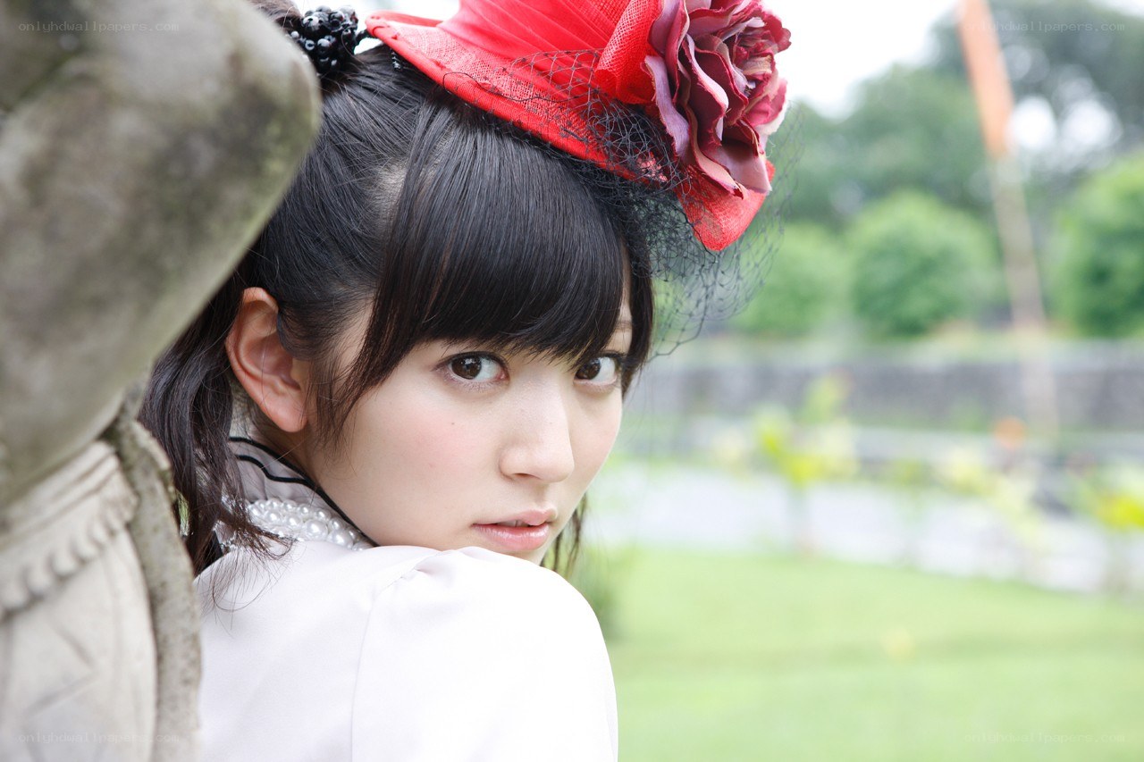 woman in red hat looking back