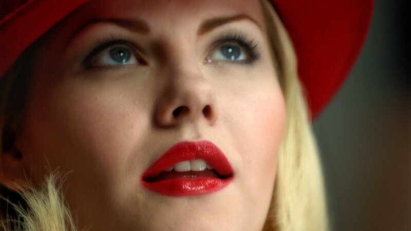 woman in red hat looking up