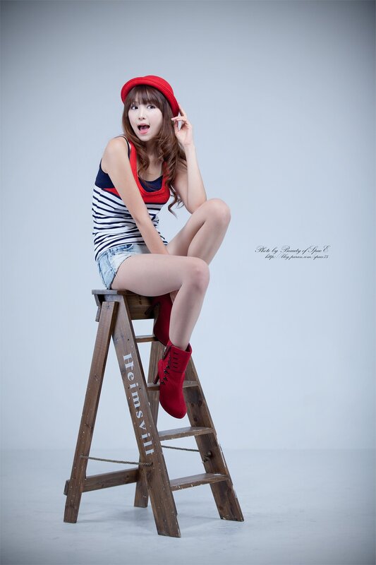 woman in red hat on ladder