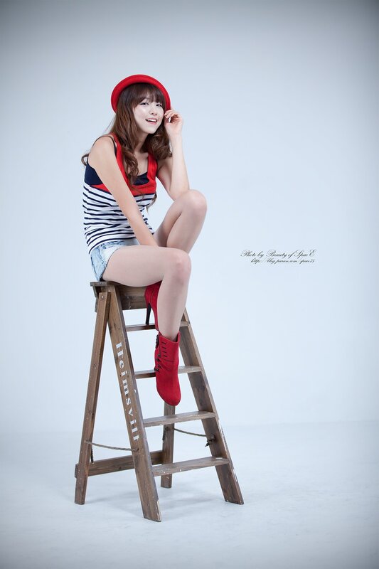 woman in red hat on ladder