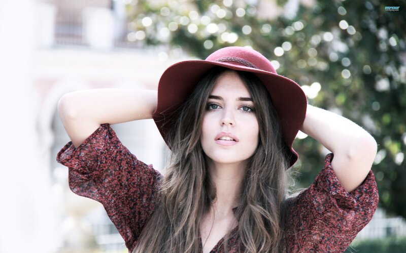 woman in red hat outdoors
