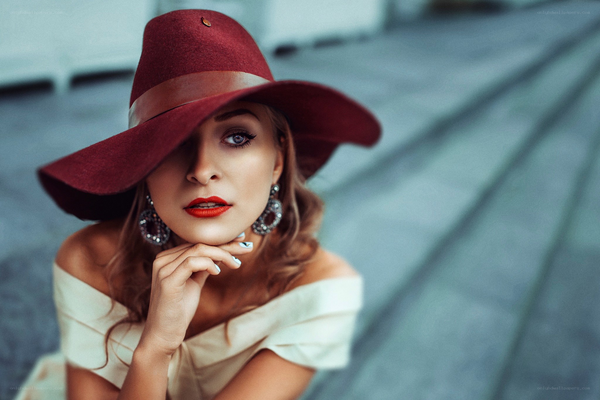 woman in red hat posing