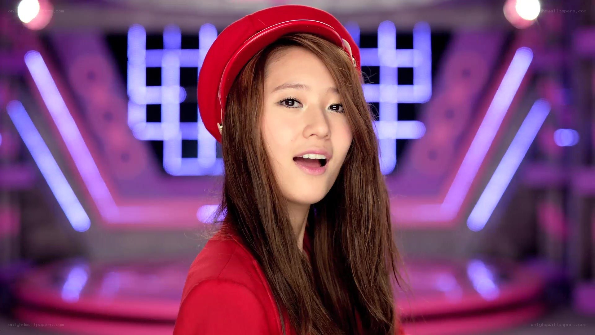 woman in red hat singing