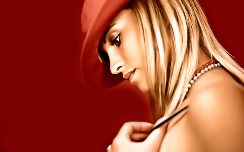 woman in red hat with necklace