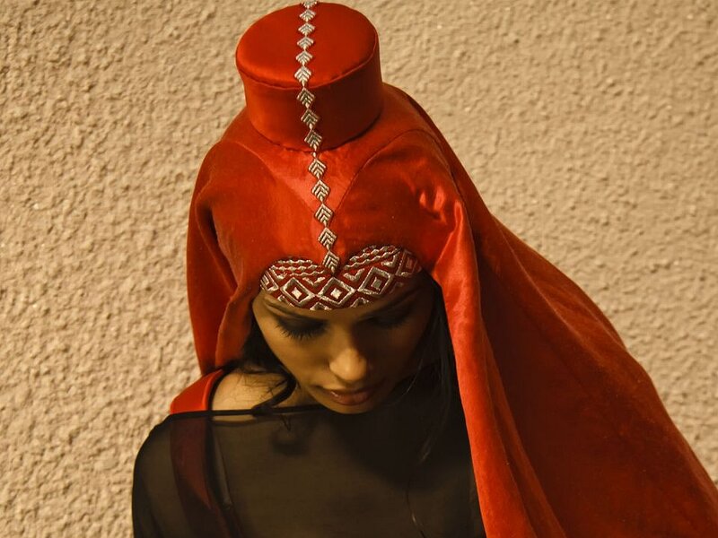 Woman in Red Headwear