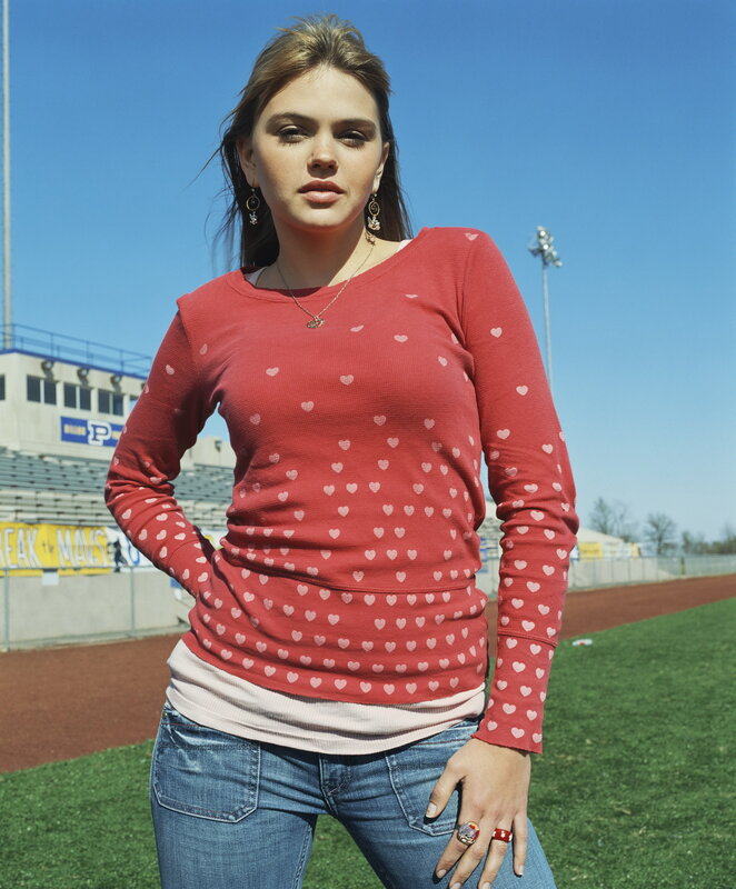woman in red heart sweater