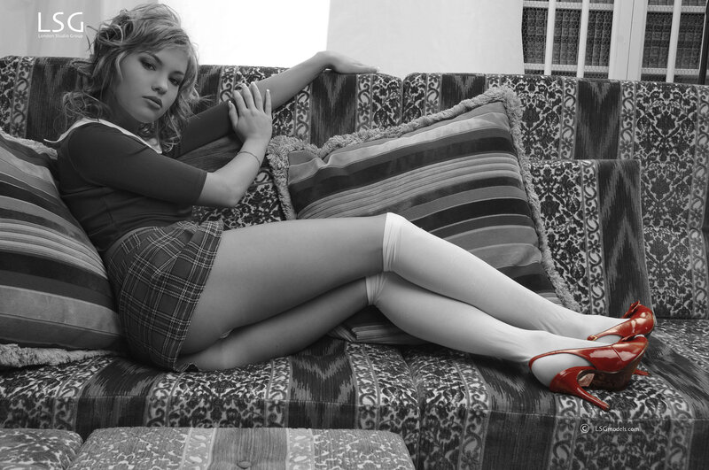 woman in red heels on couch