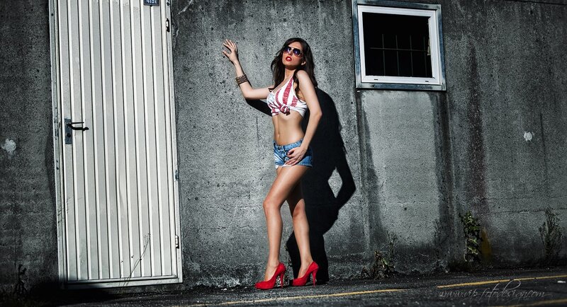 woman in red heels posing
