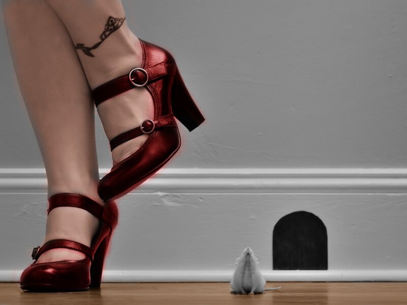 woman in red heels with mouse
