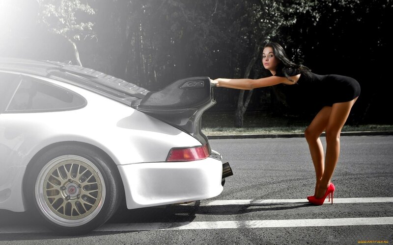 woman in red heels with sports car