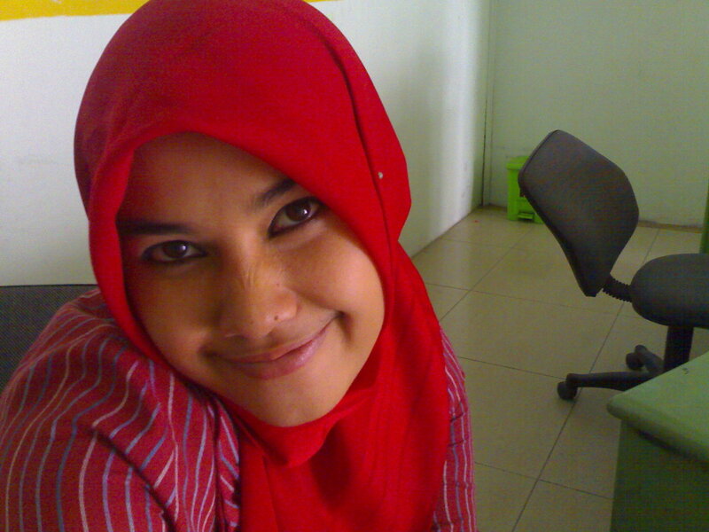 woman in red hijab smiling