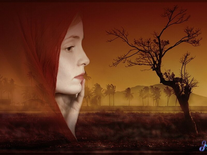 woman in red hood at sunset
