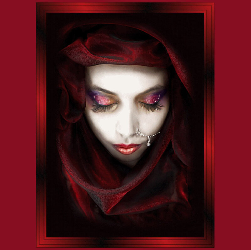 woman in red hood with dramatic makeup