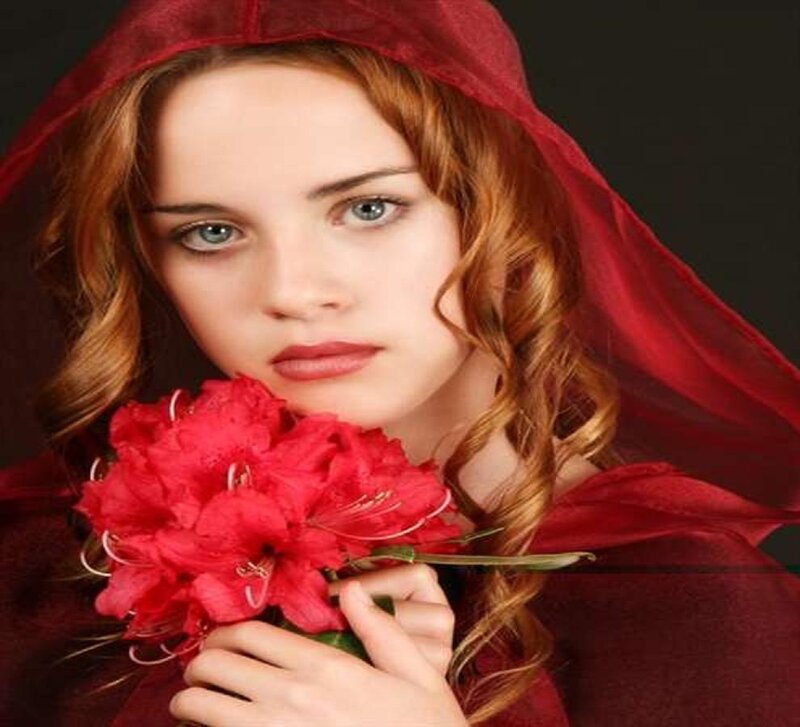 woman in red hood with flowers
