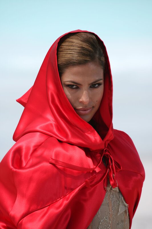 woman in red hooded cloak