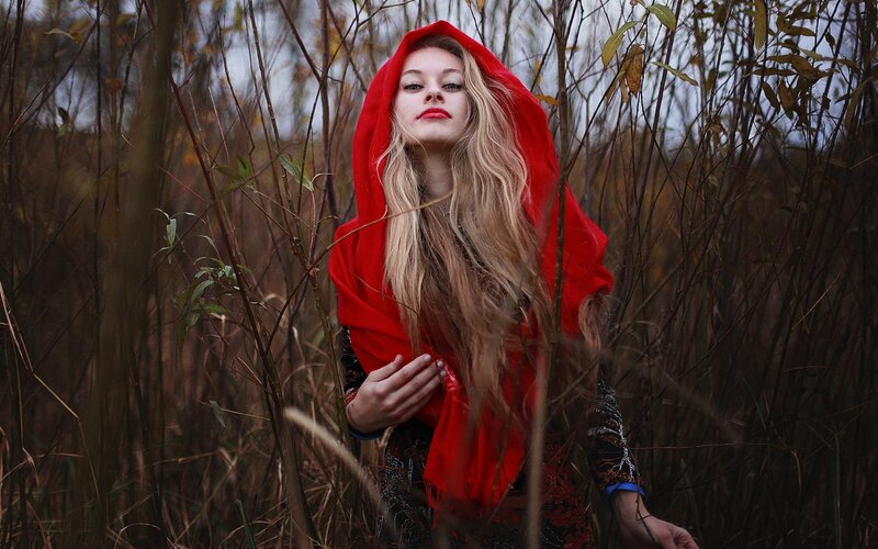 woman in red hooded cloak
