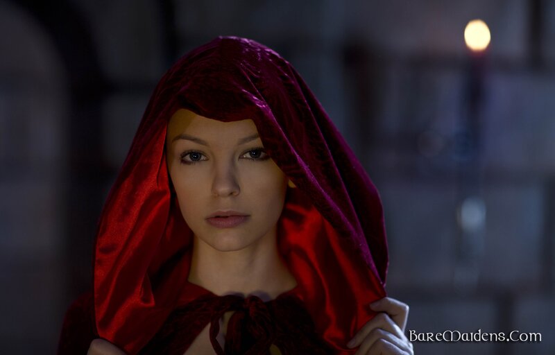 woman in red hooded cloak