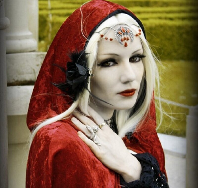 woman in red hooded cloak