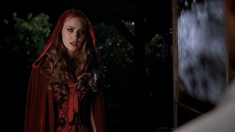 woman in red hooded cloak