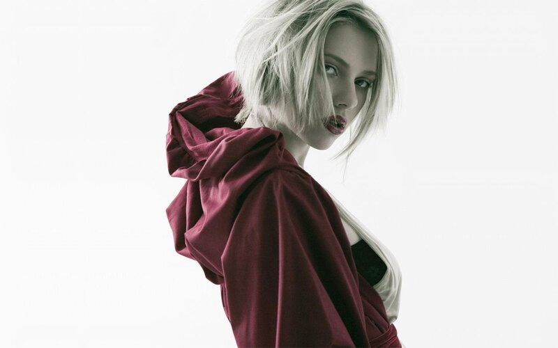 woman in red hooded garment