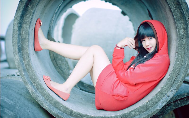 Woman in Red Hoodie — Calm, Photograph, Concrete Pipe