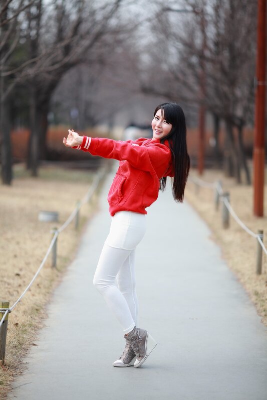 woman in red hoodie on path