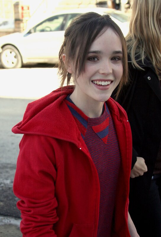 woman in red hoodie smiling
