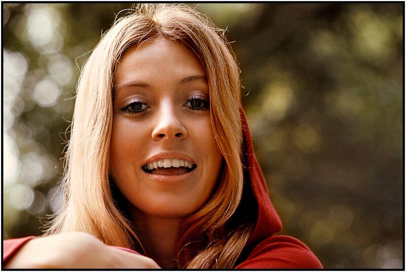 woman in red hoodie smiling